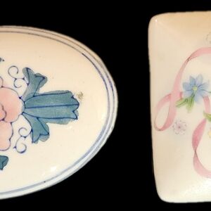 Two Vintage Trinket Boxes. Oval and square with flowers and ribbons on top.